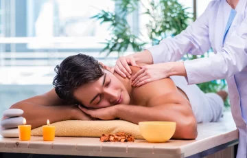 Man is enjoying and feeling relaxed while taking deep tissue massage therapy from a expert massage therapist in angle spa center g9 Islamabad